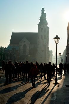 Crowded street and St. Andrew's Church in the sunshine day, Krak��w