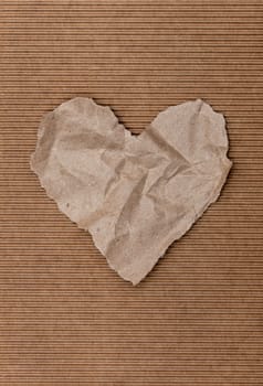 Torn paper heart on a red background