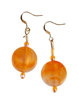 Earrings made of plastic imitation amber Isolated on white background

