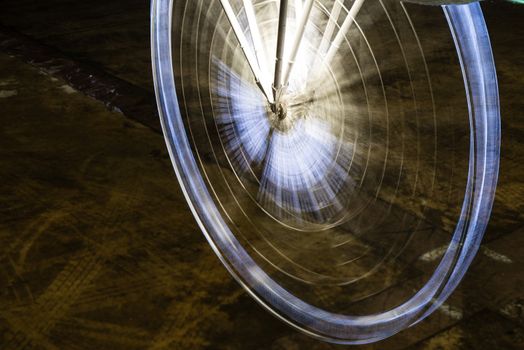 Fairy wheel in an amusement park during night time, taken at slow shutter.