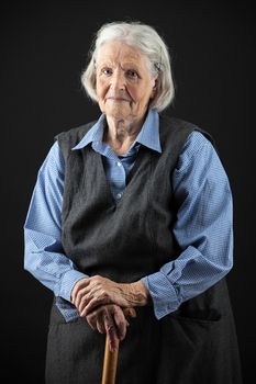 Portrait of a calm senior woman looking at the camera. Over white background.