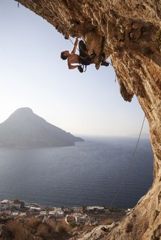 Rock climber at sunset, Kalymnos Island, Greece