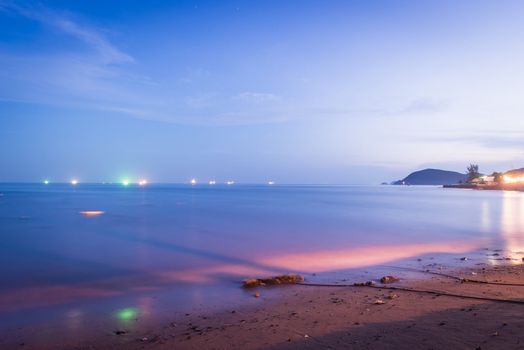 Colorful night sea, at twilight with blue sky background