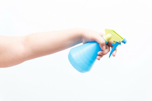 Asian woman holding a water sprayer for ironing, isolated