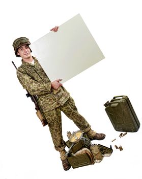 young American soldier in camouflage uniform shows a sign