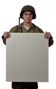 young American soldier with M1 helmet shows a signs