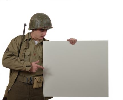 young American soldier with M1 helmet shows a signs