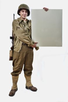 American soldier with M1 helmet shows a signs