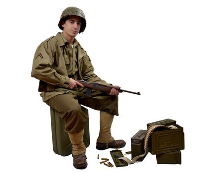 young American soldierwith his M1 carbine sitting on a jerrycan 