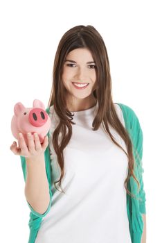 Young casual woman holding piggy-bank. Isolated on white.