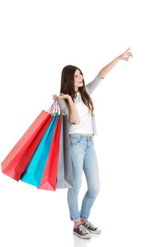 Young beautiful woman is shopping. Isolated on white.