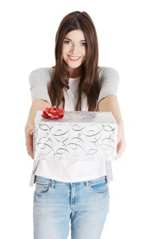 Young beautiful woman holding present with red bow. Isolated on white.