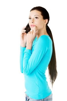 Young beautiful woman talking through phone. Isolated on white.