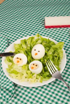 A salad decorated as a nest, funny kid food