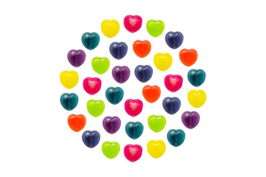 Heart shape confectionery is set in full circle style on white background