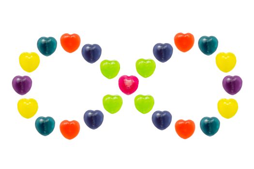 Heart shape confectionery is set in infinity style on white background