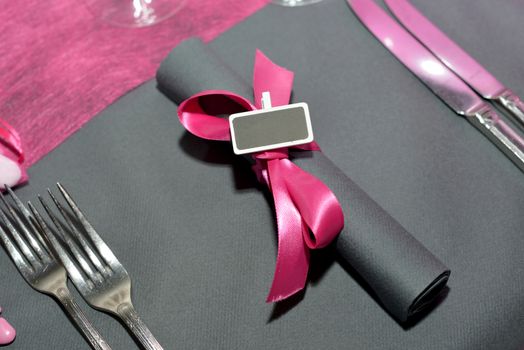 purple table service on a gray nape