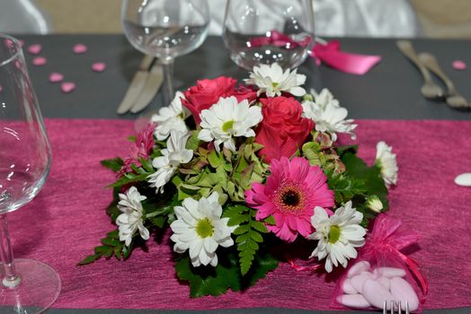 Wedding bouquet lying on a gray tablecloth