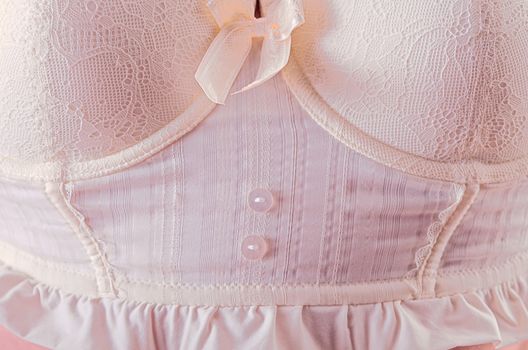 Close-up of white corsage with lace