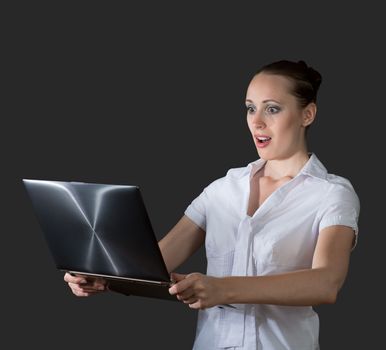 image of young business woman holding laptop