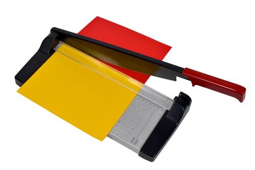 cutting paper with two sheets of colors red and yellow