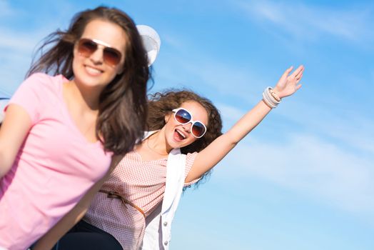 young attractive woman in sunglasses got out of the car window and laugh