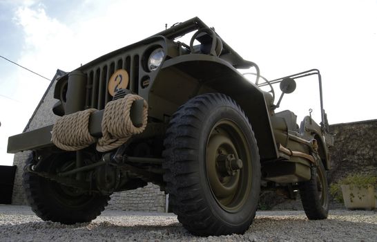 world war two military vehicle with a rope on the bumper