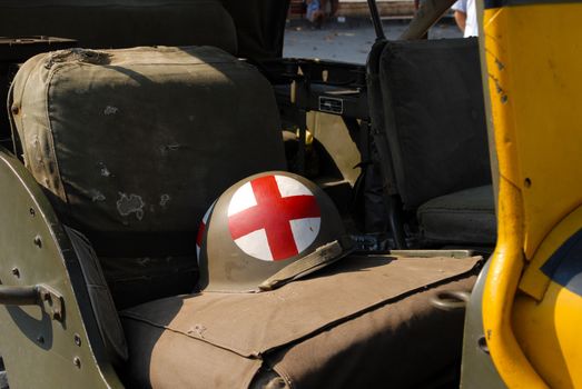 world war two military vehicle with medic helmet