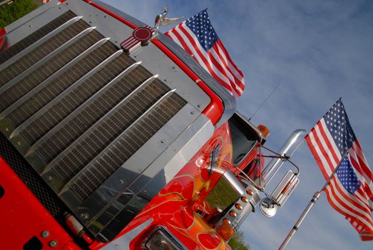 chrome grille of an American truck with us flags