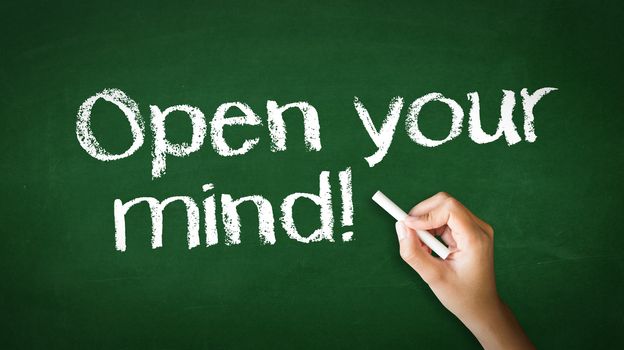 A person drawing and pointing at a Open Your Mind Chalk Illustration