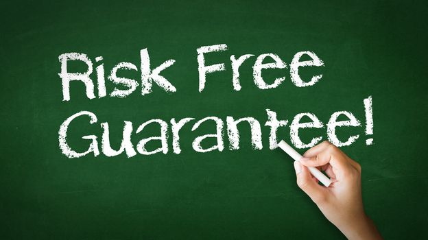 A person drawing and pointing at a Risk Free Guarantee Chalk Illustration