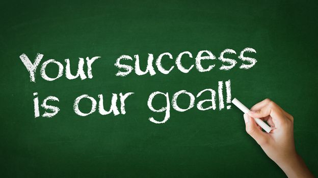 A person drawing and pointing at a Your Success is our goal Chalk Illustration