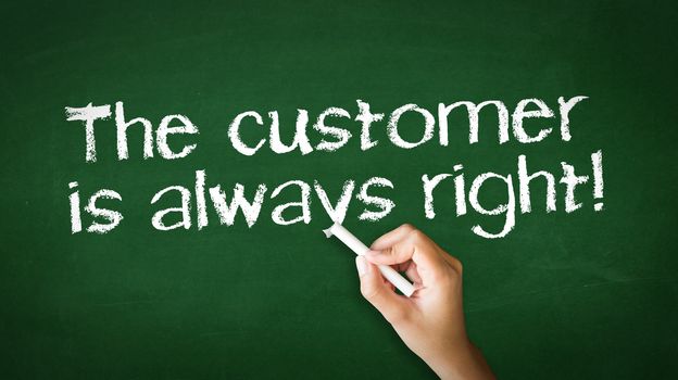 A person drawing and pointing at a The customer is always right Chalk Illustration