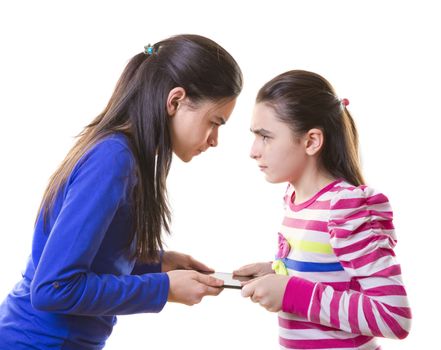 Teen girls Fighting for digital tablet  on white background
