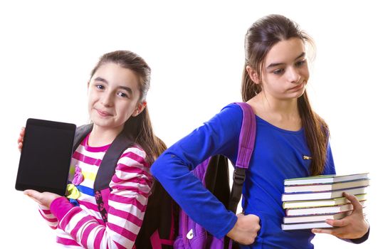 Teenage Girls Using Digital Tablet and books

