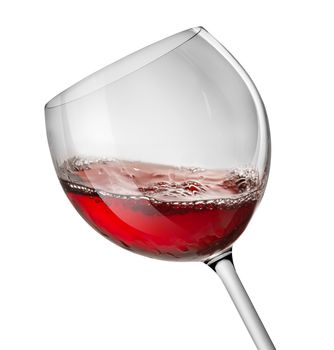 Moving red wine glass over a white background