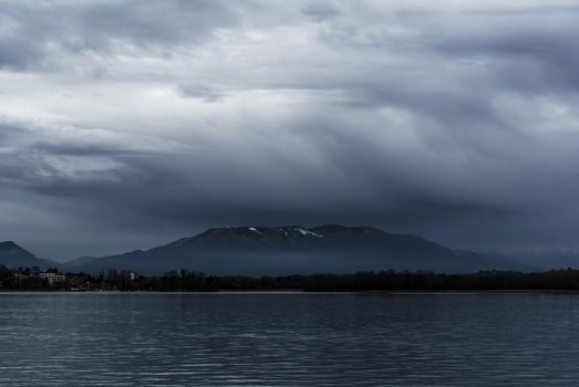 Mountain Campo di Fiori seen from Arona in a gray winter day, Italy