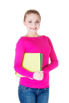 Young student woman with workbook. Isolated on white.