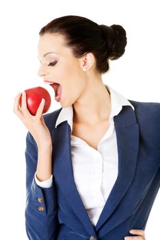 Young business woman with red apple. Isolated on white.