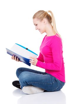 Young student woman with workbook. Isolated on white.