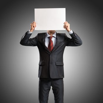 business man holding a poster, place for text