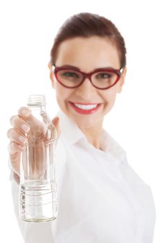 Beautiful business woman with plastic bottle of water. Isolated on white.