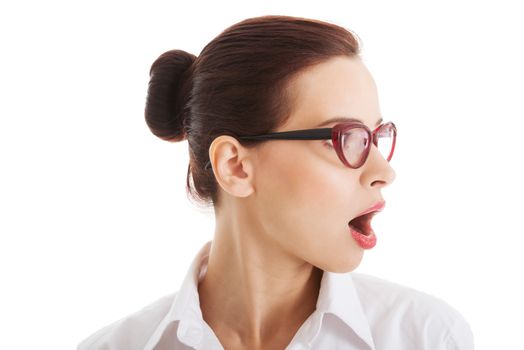 Profile of shocked, surprised woman in eyeglasses. Isolated on white.