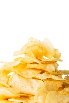 Yellow, tasty but unhealthy potatoe chips. Isolated on white.