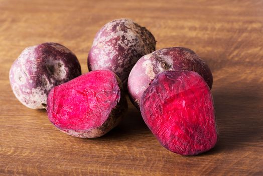 fresh, raw Beetroots over wooden background.
