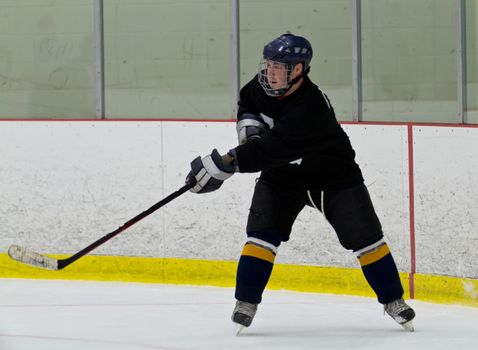 Hockey player taking a shot during a game