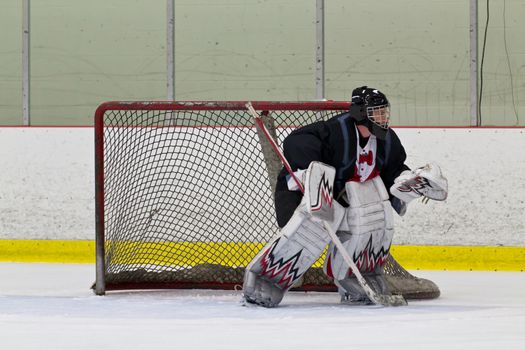 Ice hockey goalie ready to make a save