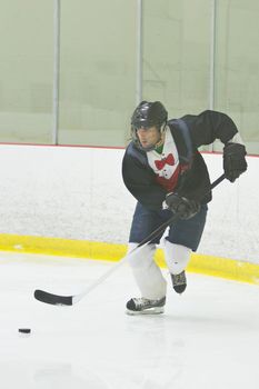 Hockey player skating with the puck