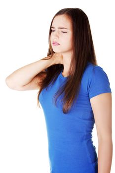 Young casual woman is touching her neck. Isolated on white.