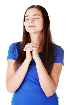 Young beautiful woman is praying. Isolated on white.